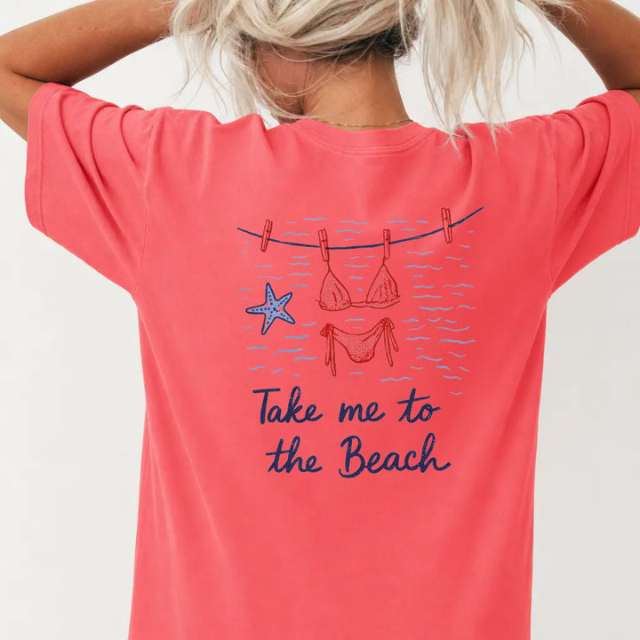 Woman wearing a watermelon red beach vacation graphic tee with bikini clothesline back print