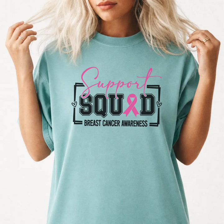 Woman wearing a seafoam breast cancer awareness women&