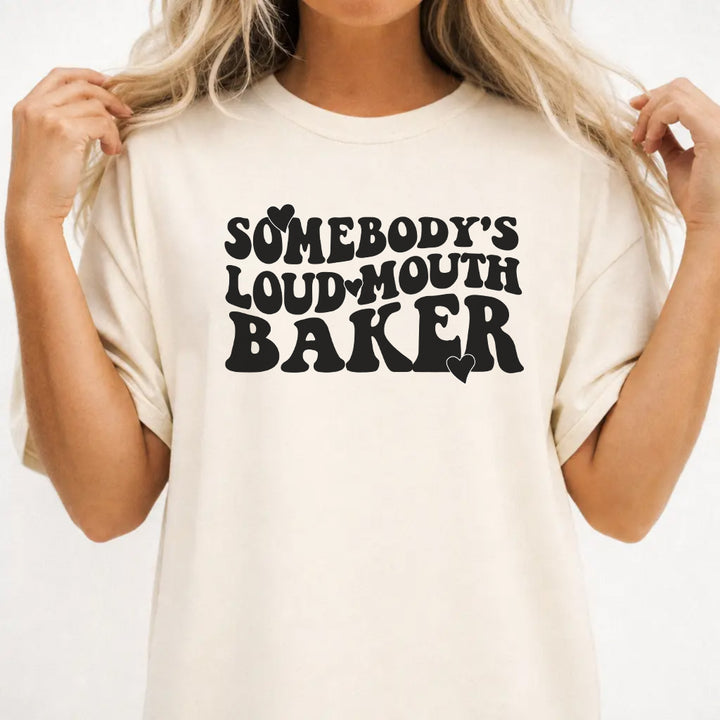 Woman wearing an ivory funny loud mouth baker women&