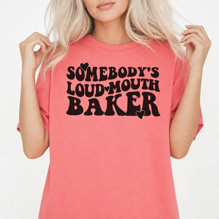 Woman wearing a watermelon-colored funny loud mouth baker women&