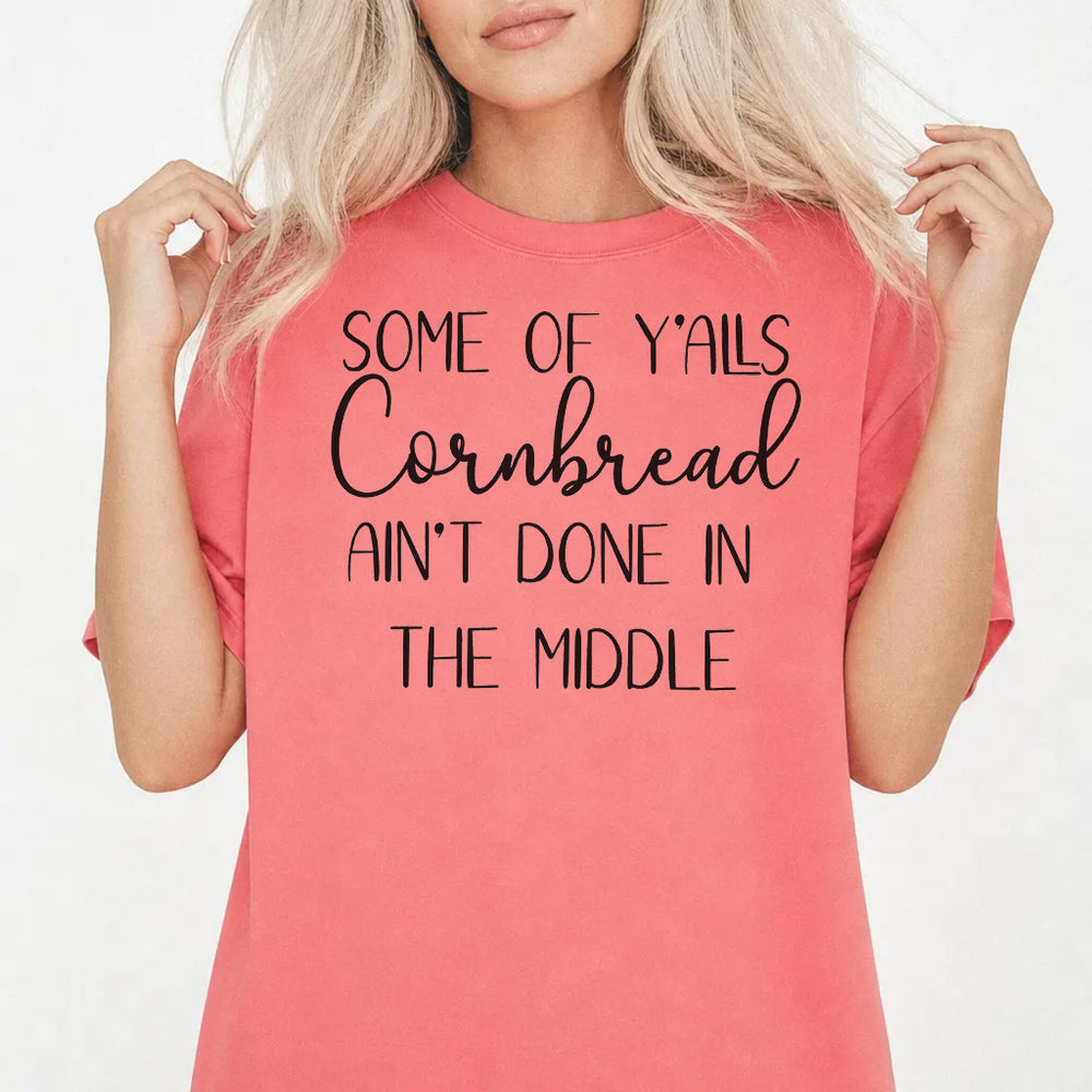 Woman wearing a watermelon-colored funny southern saying women's graphic tee with mixed block and cursive lettering, front print