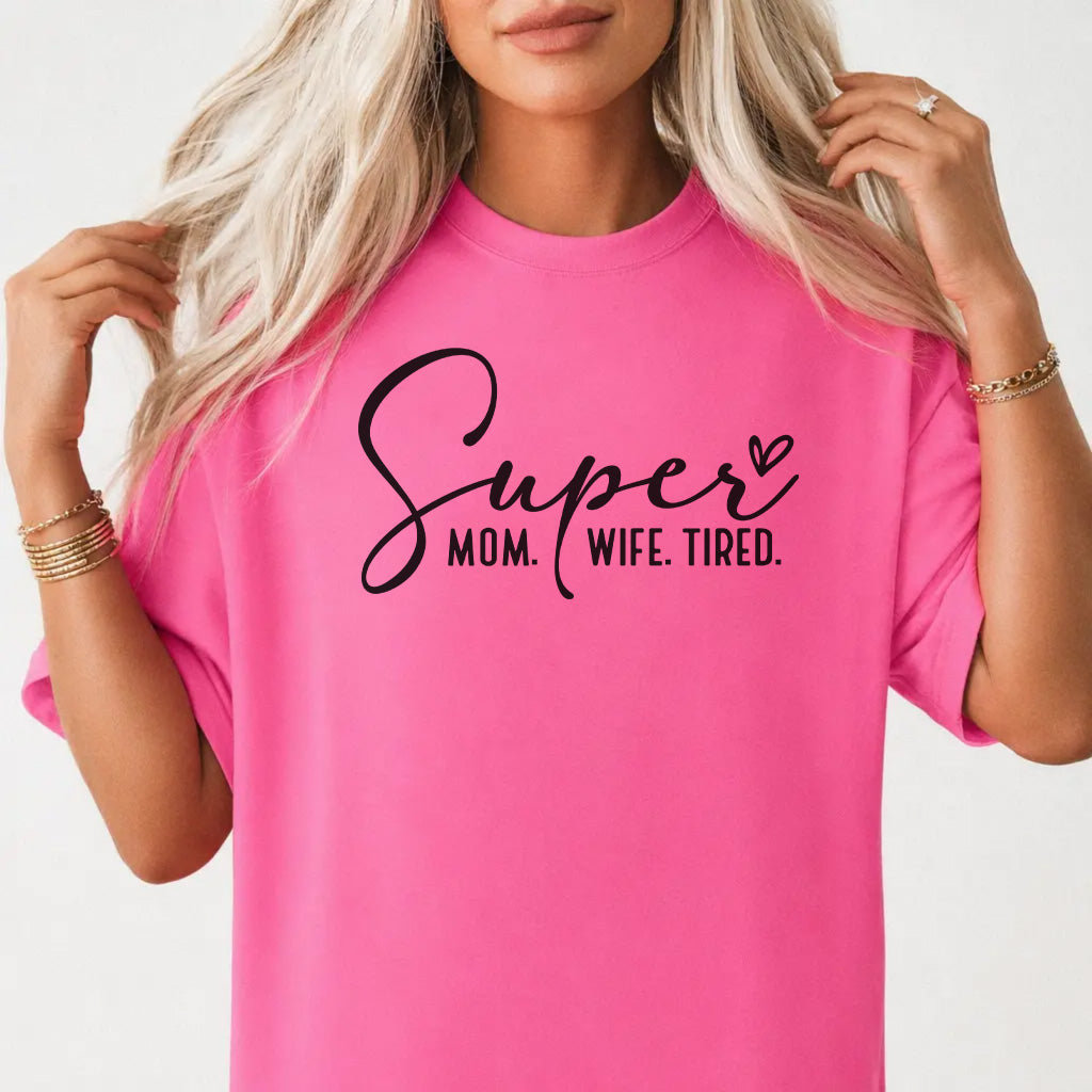 Woman wearing a neon pink funny tired mom women&