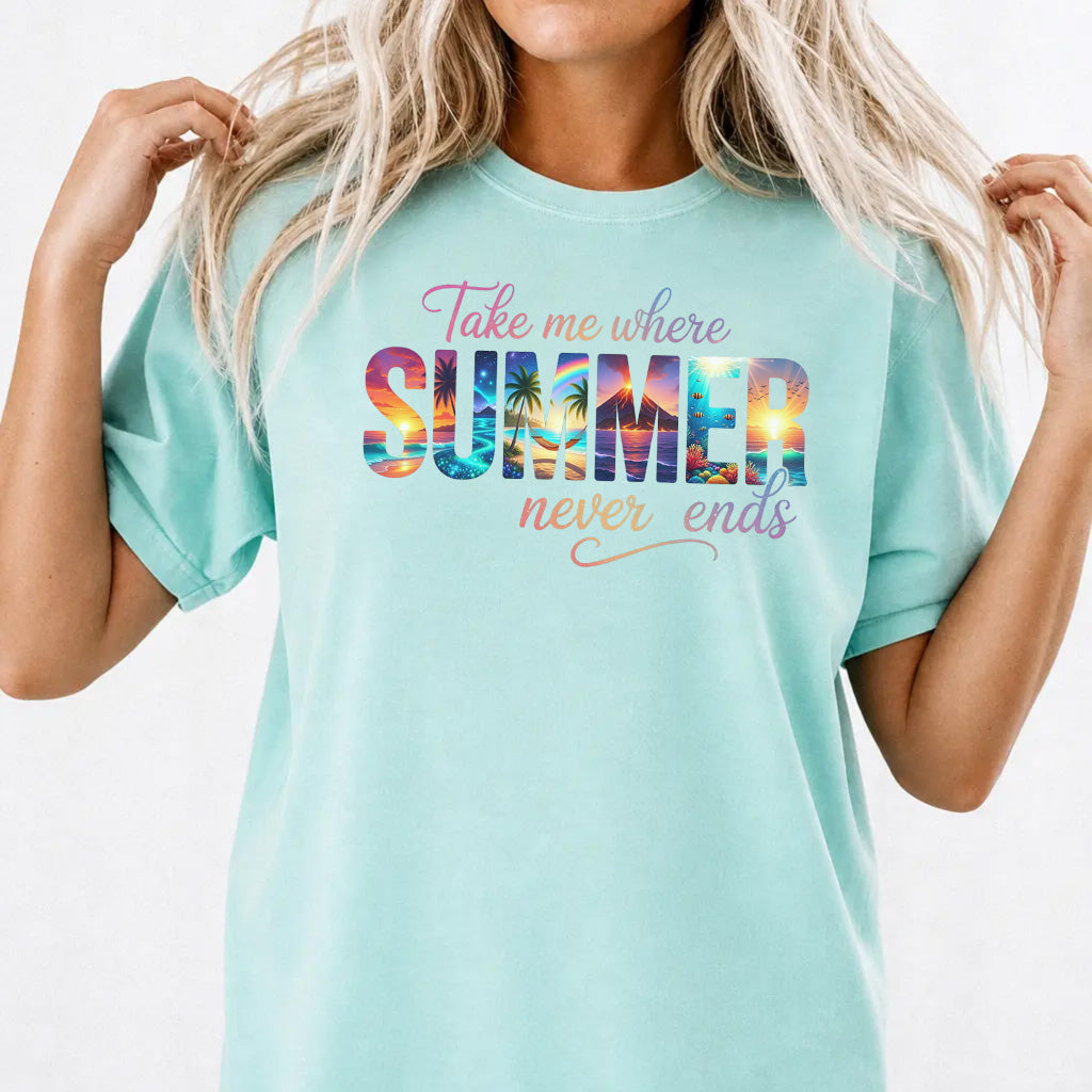 Woman wearing a chalky mint oversized tropical summer graphic tee with sunset beach lettering