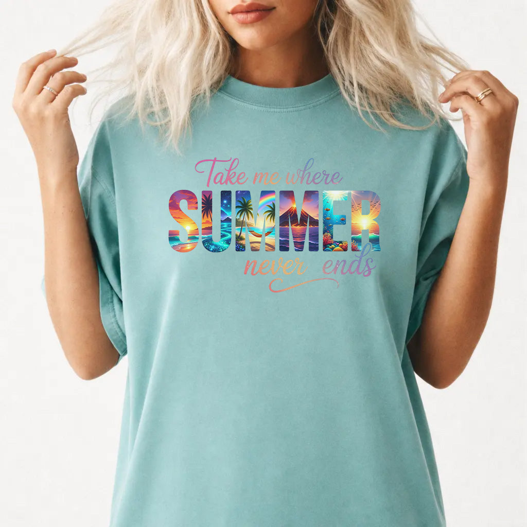 Woman wearing a seafoam oversized tropical summer graphic tee with sunset beach lettering
