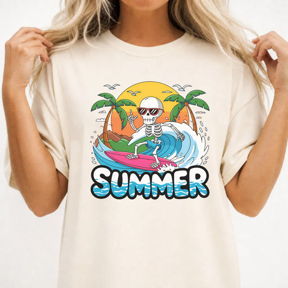 Woman wearing an ivory skeleton surfer summer women's graphic tee with a surfing skeleton and tropical scene, front print