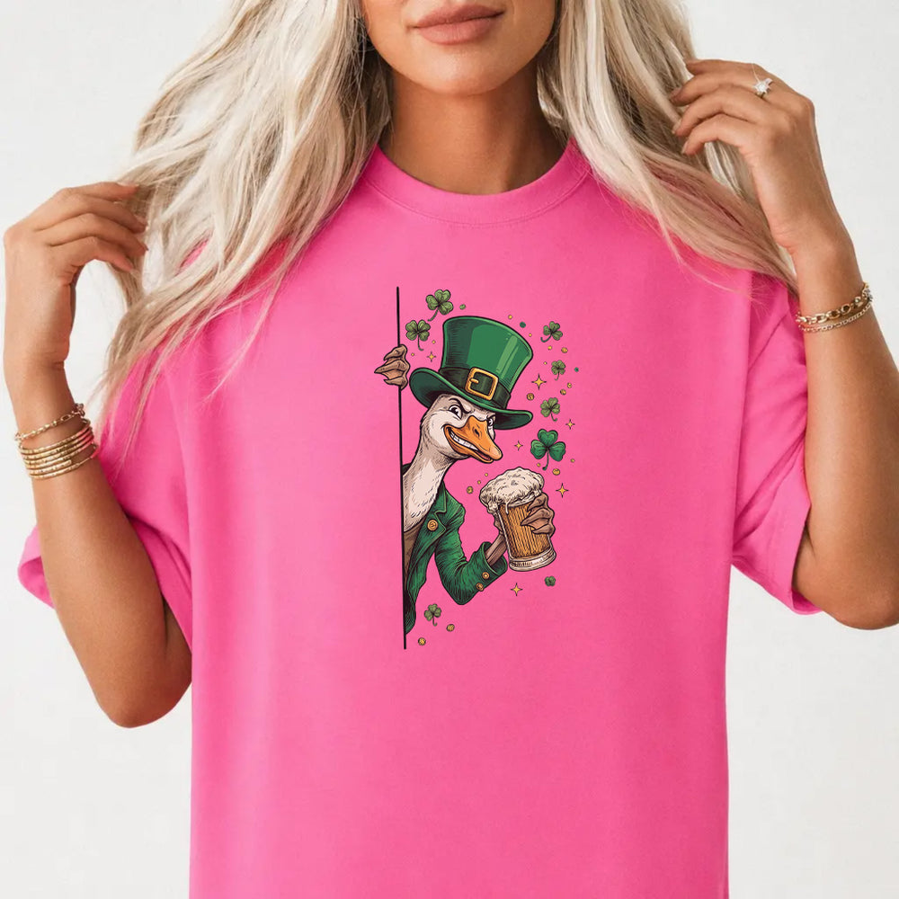 Woman wearing a neon pink St. Patrick's Day duck beer women's graphic tee with a leprechaun goose peeking around a wall with a beer mug front print