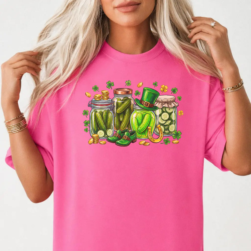 Woman wearing a neon pink St. Patrick's Day pickle jar women's graphic tee with leprechaun-hat mason jars shamrocks and gold coins front print