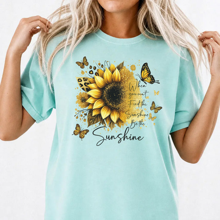 Woman wearing a chalky mint sunflower butterfly inspirational women&