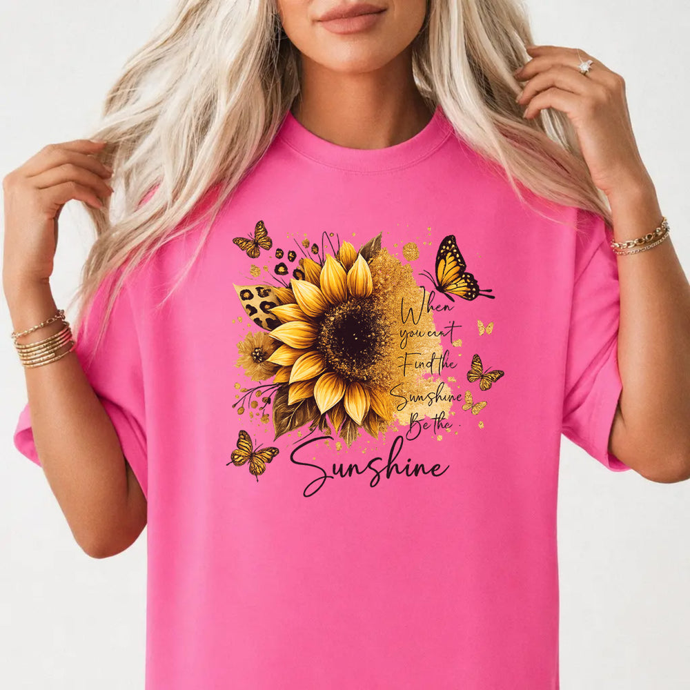 Woman wearing a neon pink sunflower butterfly inspirational women's graphic tee with gold glitter sunflower and monarch butterflies front print