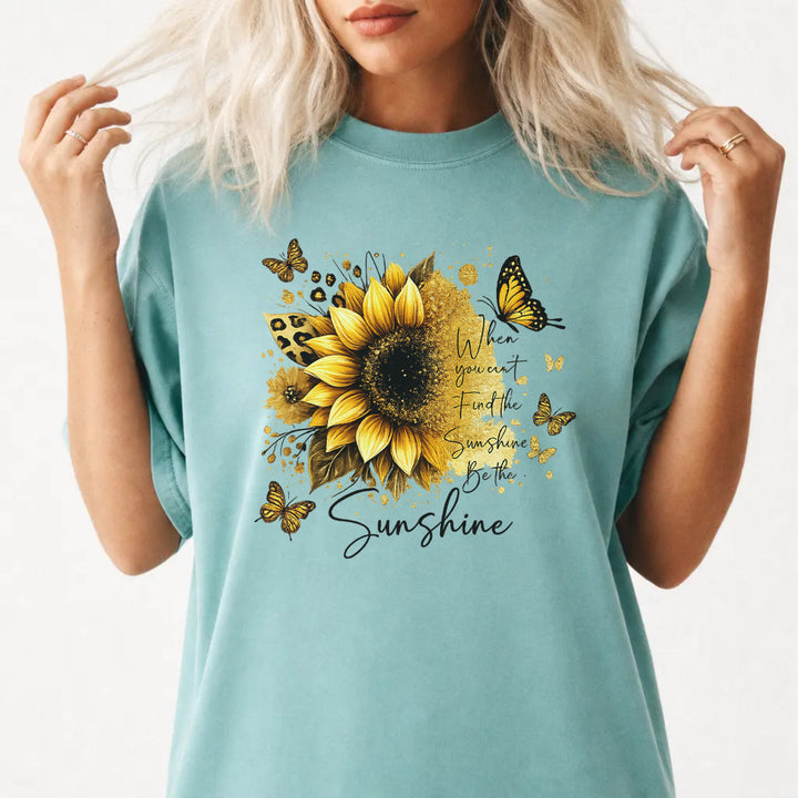 Woman wearing a seafoam sunflower butterfly inspirational women&