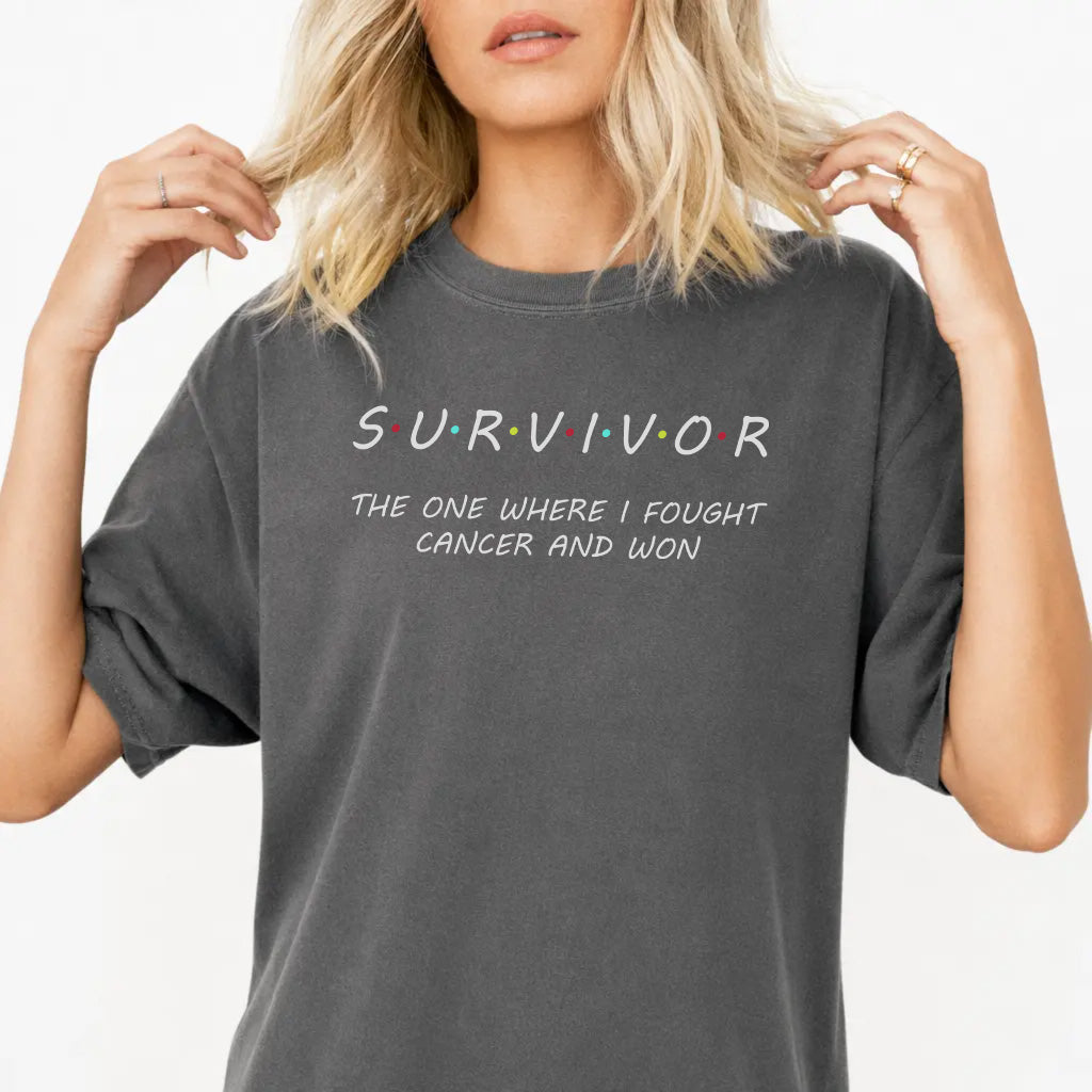 Woman wearing a pepper gray Survivor graphic tee that reads The One Where I Fought Cancer and Won